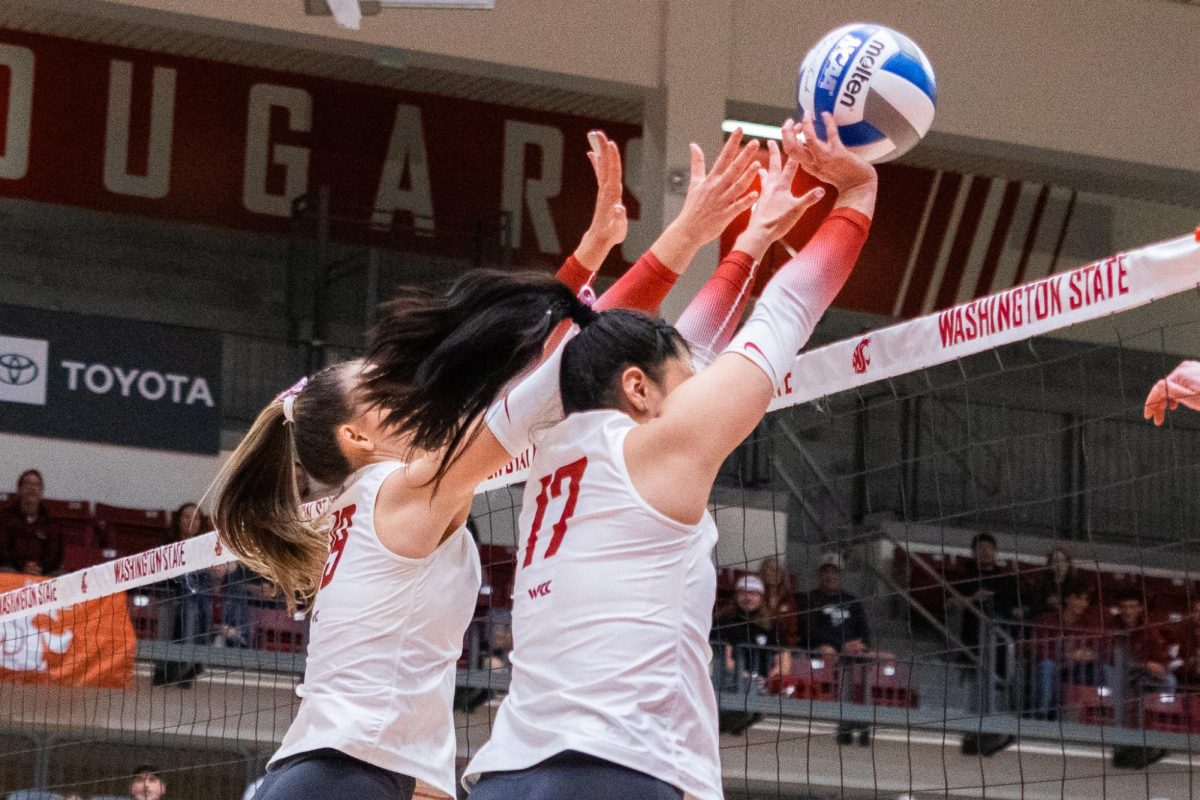 Italia Bernal (R) and Lucie Blažková (L) combine to halt a Portland attack at the net, Oct. 2, in Pullman, Wash. 