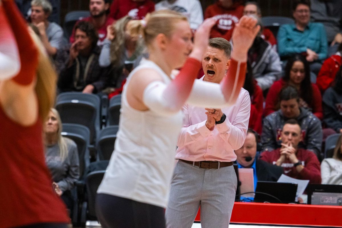 WSU head coach Korey Schroeder cheers his unit on as they go on a run against Portland, Oct. 2, in Pullman, Wash. 