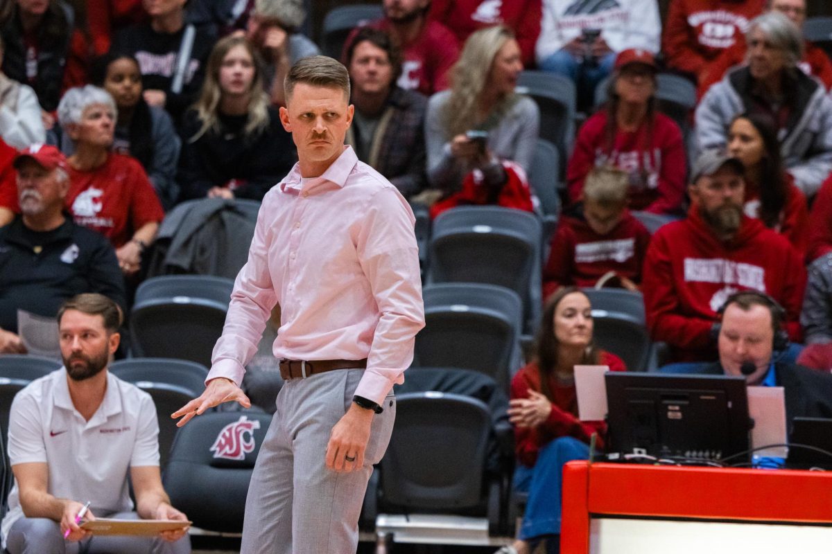 WSU head coach Korey Schroeder gives his team in-game advice against Portland, Oct. 2, in Pullman, Wash. 