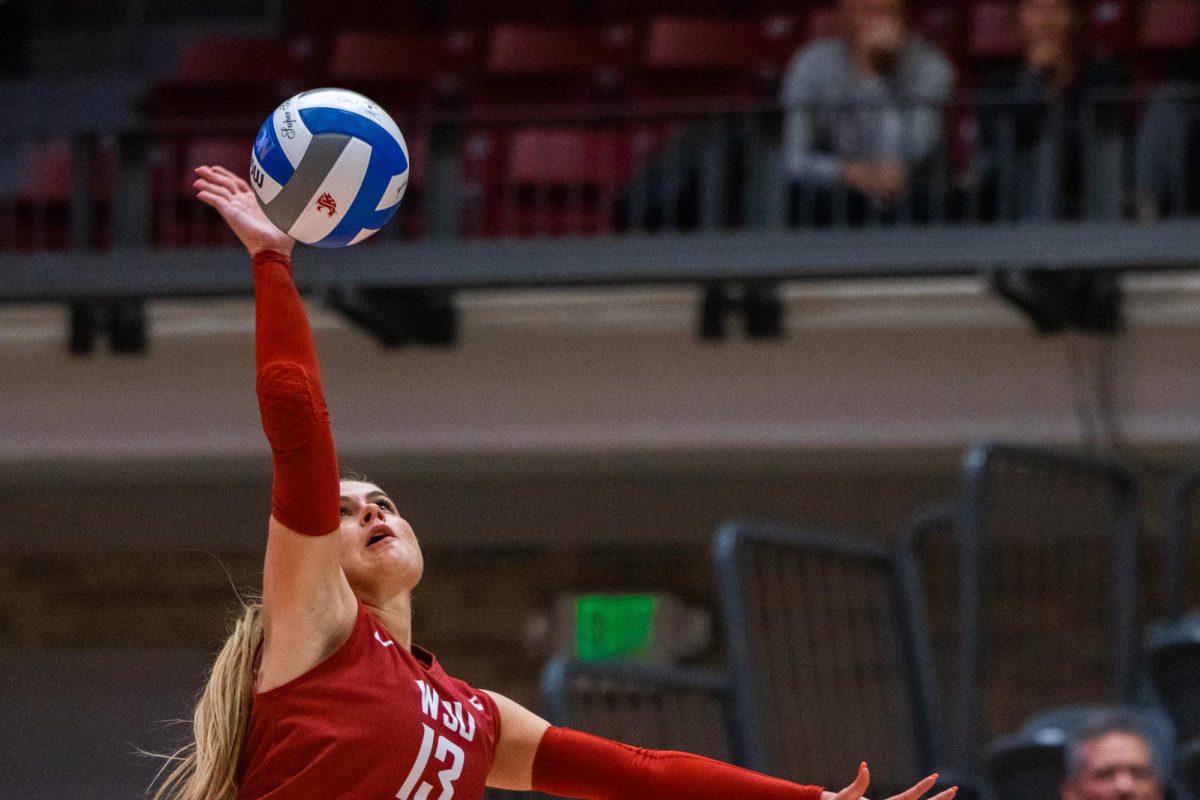 Emma Barbero connects with the ball on a serve, Oct. 2, in Pullman, Wash. 