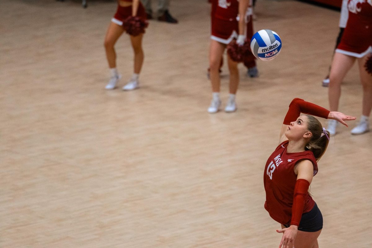 Emma Barbero watches the ball fall as she prepares a serve, Oct. 2, in Pullman, Wash. 