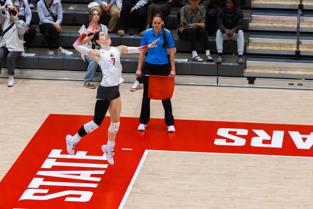 Sage Brustad jumps at the line during a serve, Oct. 2, in Pullman, Wash. 