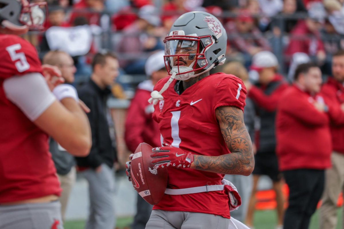 WR Kris Hutson holding the football after making a catch in the Cougars 42-10 win at Gesa field over Hawaii on Oct. 19. 