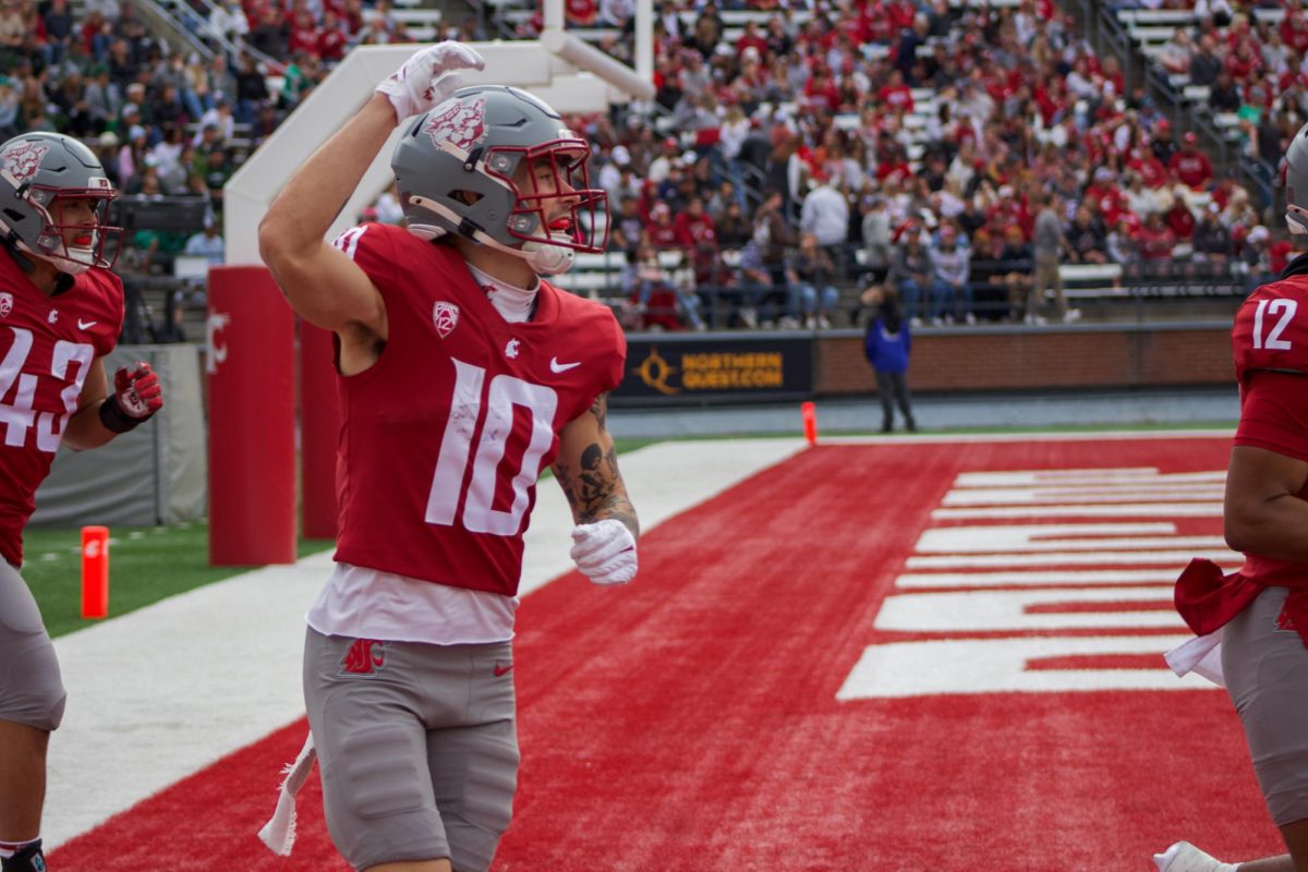 QB John Mateer celebrates a rushing touchdown during the Cougars 42-10 victory over Hawaii on Oct. 19, 2024 at Gesa field in Pullman, WA. 