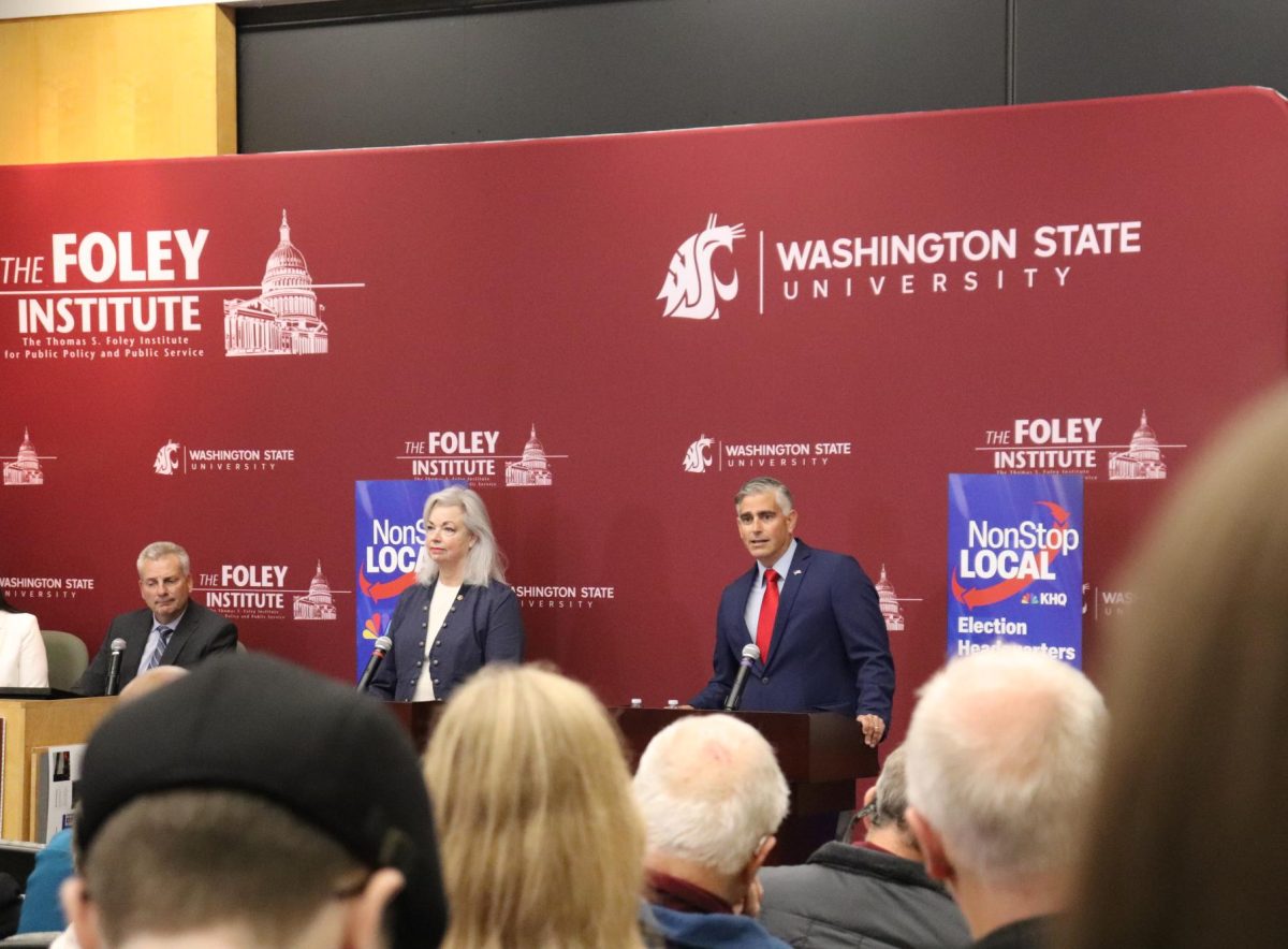 The candidates addressing the audience in Goertzen Hall Monday night.