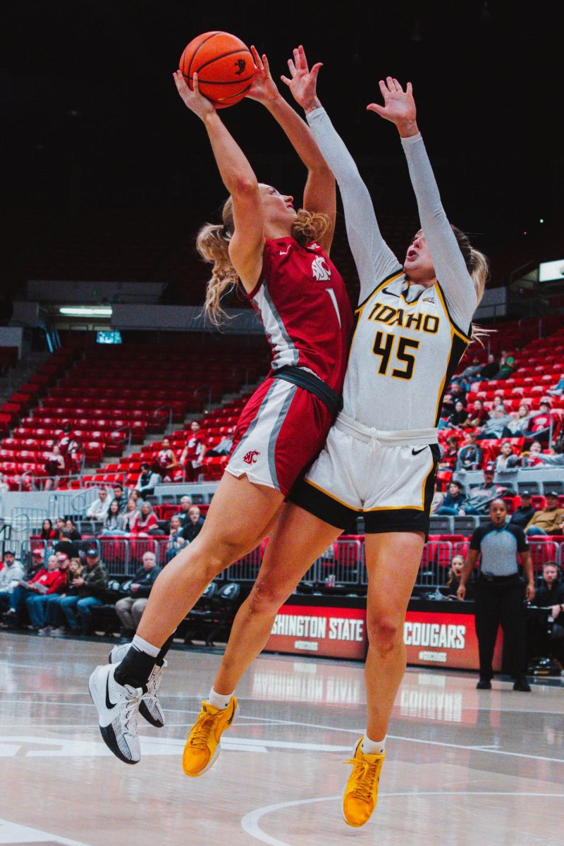 Tara Wallack rises up for a layup attempt against an Idaho defender, Nov. 10, in Pullman, Wash. 