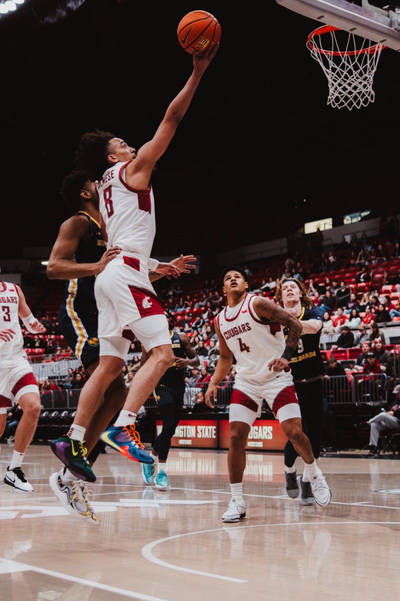 Nate Calmese floats the ball for layup attempt, Nov. 18, in Pullman, Wash.