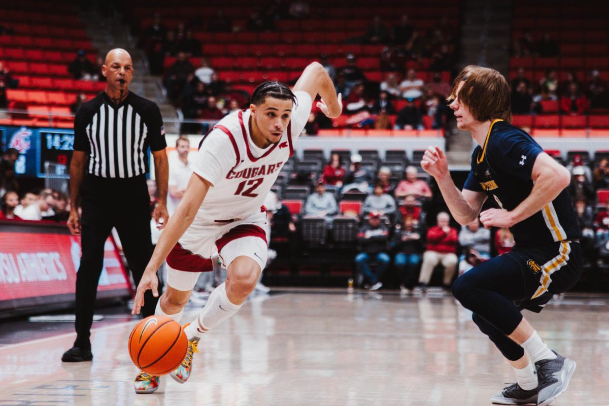 Isaiah Watts gets a step on a defender and drives through the lane, Nov. 18, in Pullman, Wash.