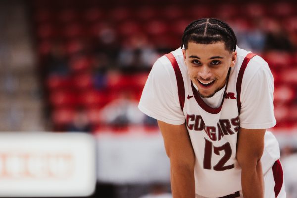 Isaiah Watts smiling during an inbounds play, Nov. 18, in Pullman, Wash.