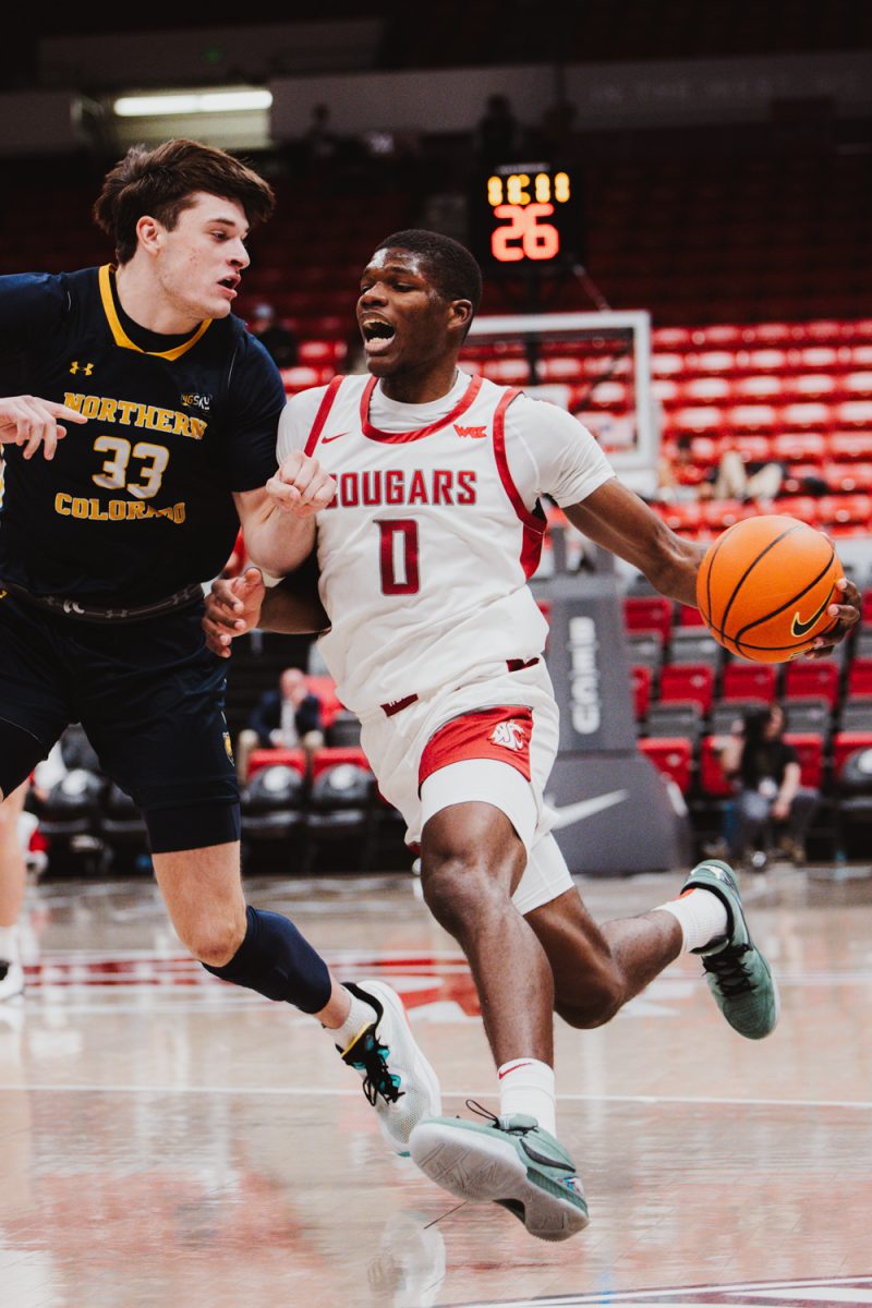 Cedrick Coward drives through the lane before scoring 2 of his 30 points against Northern Colorado, Nov. 18, in Pullman, Wash.