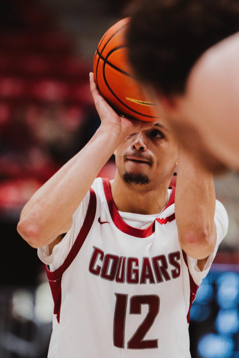 WSU guard Isaiah Watts maintains focus on the rim during a free throw attempt, Nov. 18, in Pullman, Wash.