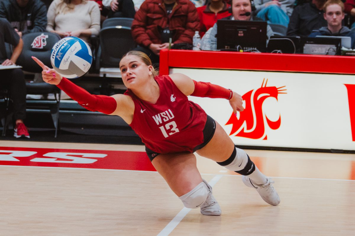 Libero Emma Barbero points one finger out after she gets a diving dig, Nov. 9, in Pullman, Wash. 