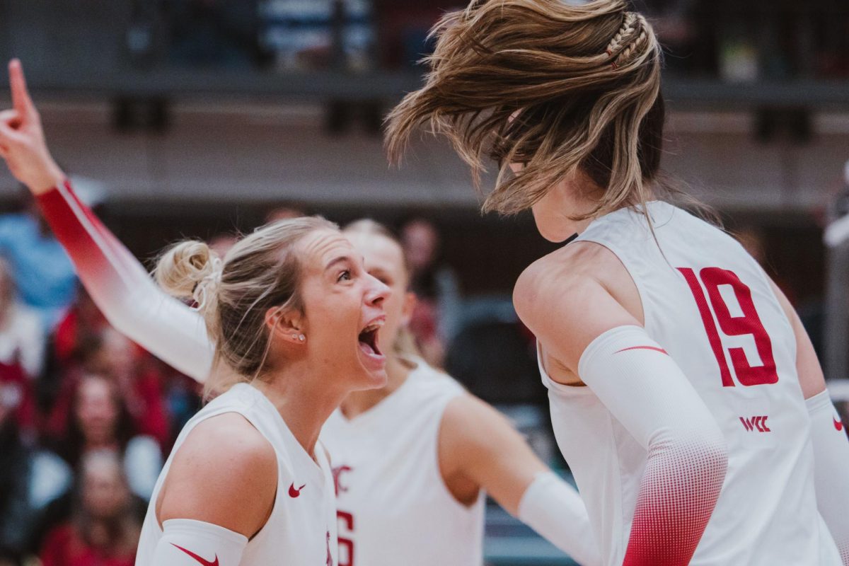 Jaden Walz celebrates toward Lucie Blažková after scoring a point, Nov. 9, in Pullman, Wash. 