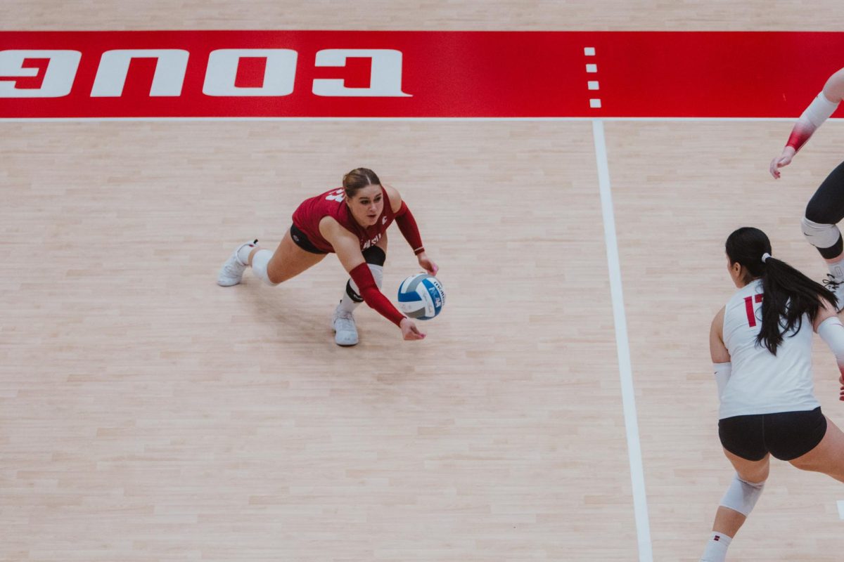 Emma Barbero begins to dive for a ball from a Saint Mary's attack, Nov. 9, in Pullman, Wash. 