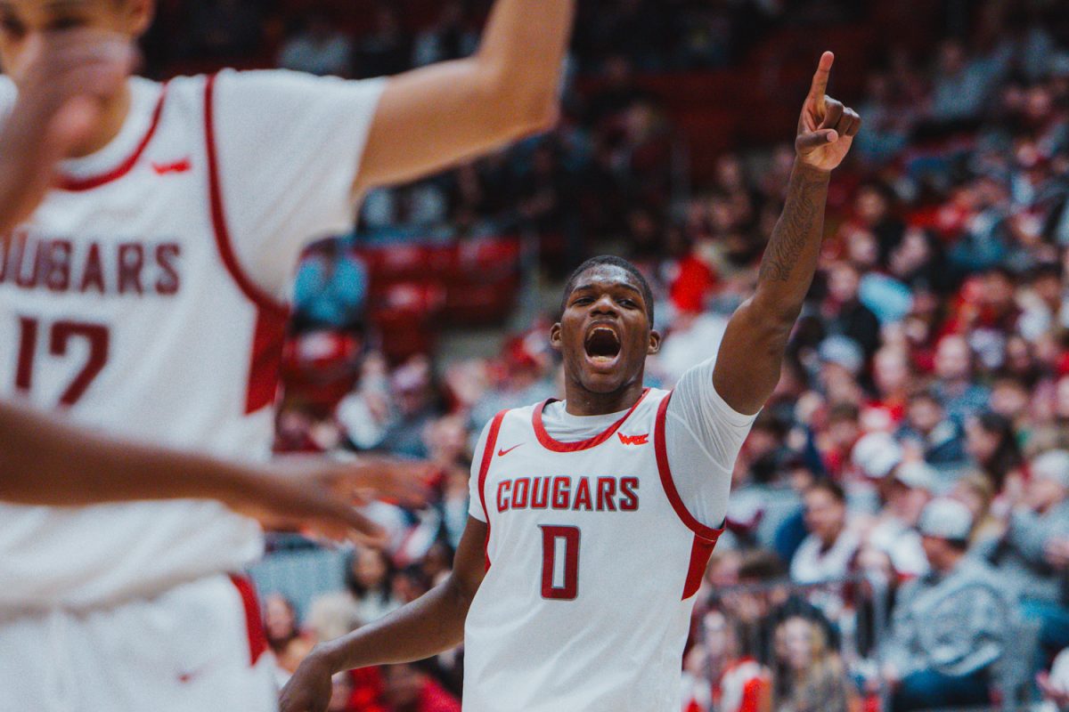 Cedric Coward celebrates after a WSU basket, Nov. 9, in Pullman, Wash. 