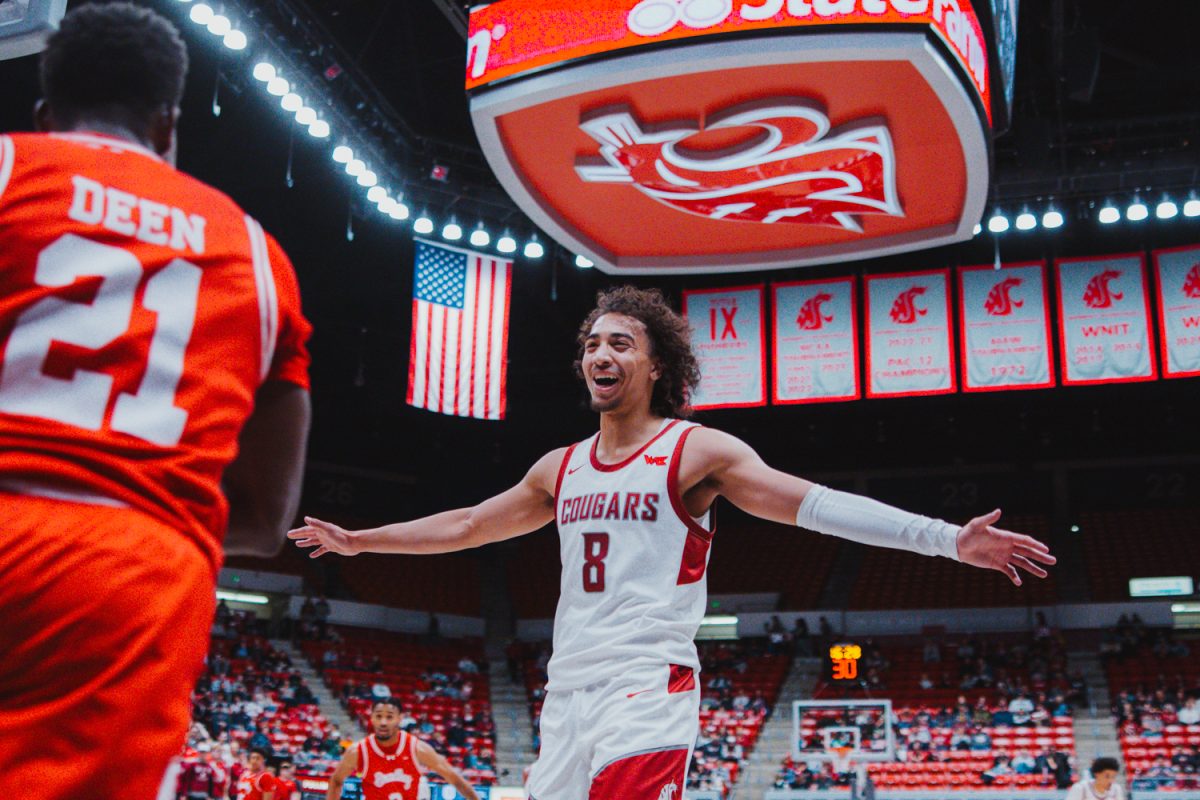 Nate Calmese smiles at a Bradley player after forcing several turnovers on inbounds passes, Nov. 9, in Pullman, Wash. 