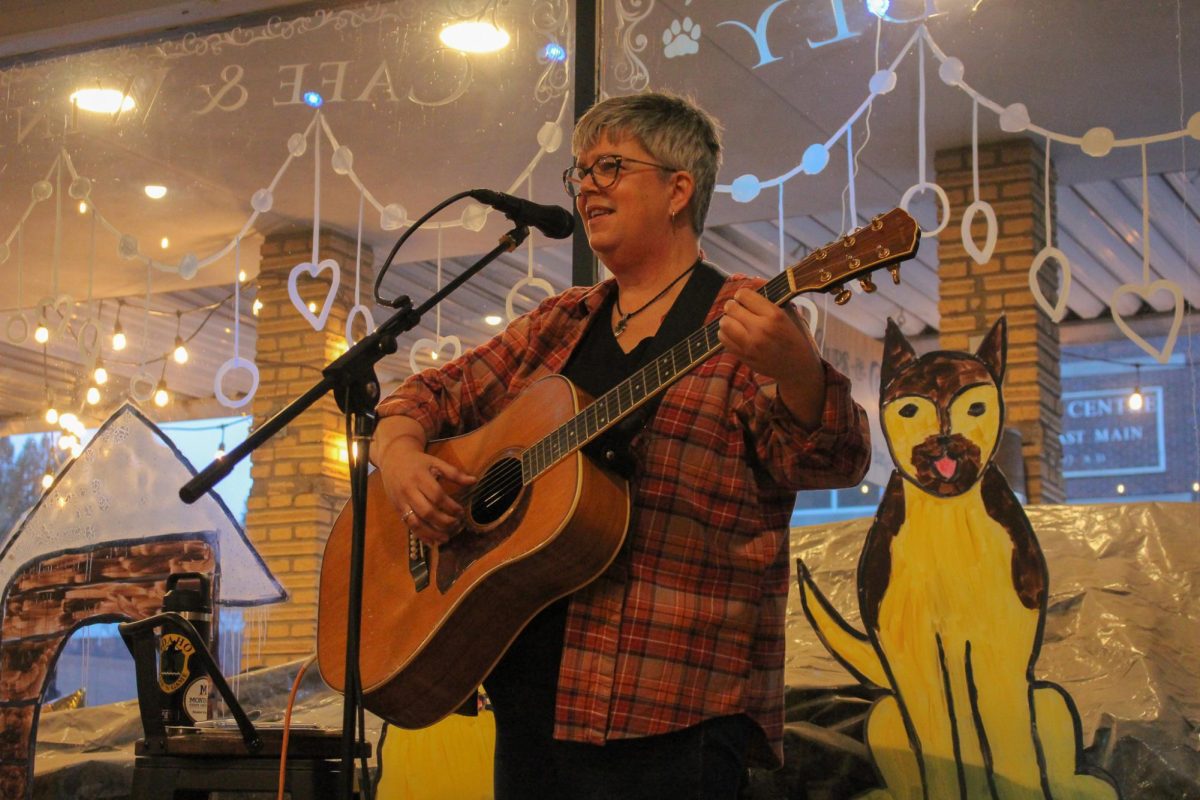 Leslie Jo Sena performing at Pups & Cups Cafe during the Main Street Music Festival on Nov. 16