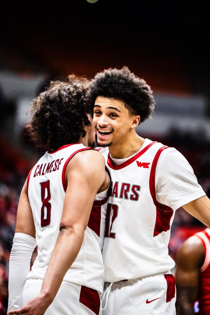 Isaiah Watts and Nate Calmese celebrate during the Cougars win over Bradley