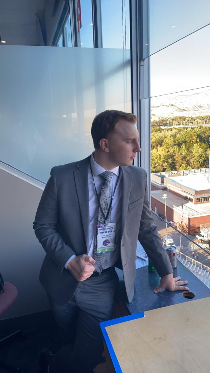 Luke Westfall gazes over the field before broadcasting the WSU vs Boise State football game for KUGR from Albertson Statium in Boise, Idaho.