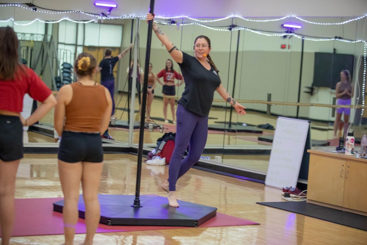 Laura Yasinitsky, a Fitness Coordinator for WSU’s University Recreation, teaching a Queer Pole Fitness class.