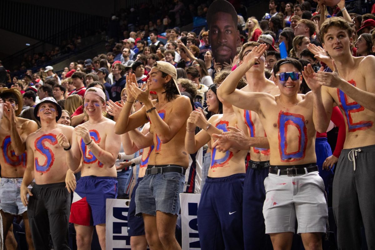 Students in Gonzaga's student section with letters painted on their chests, Jan. 13, 2025.