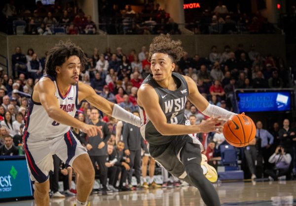 Nate Calmese drives to the basket against a Gonzaga defender on Jan. 13, 2025.