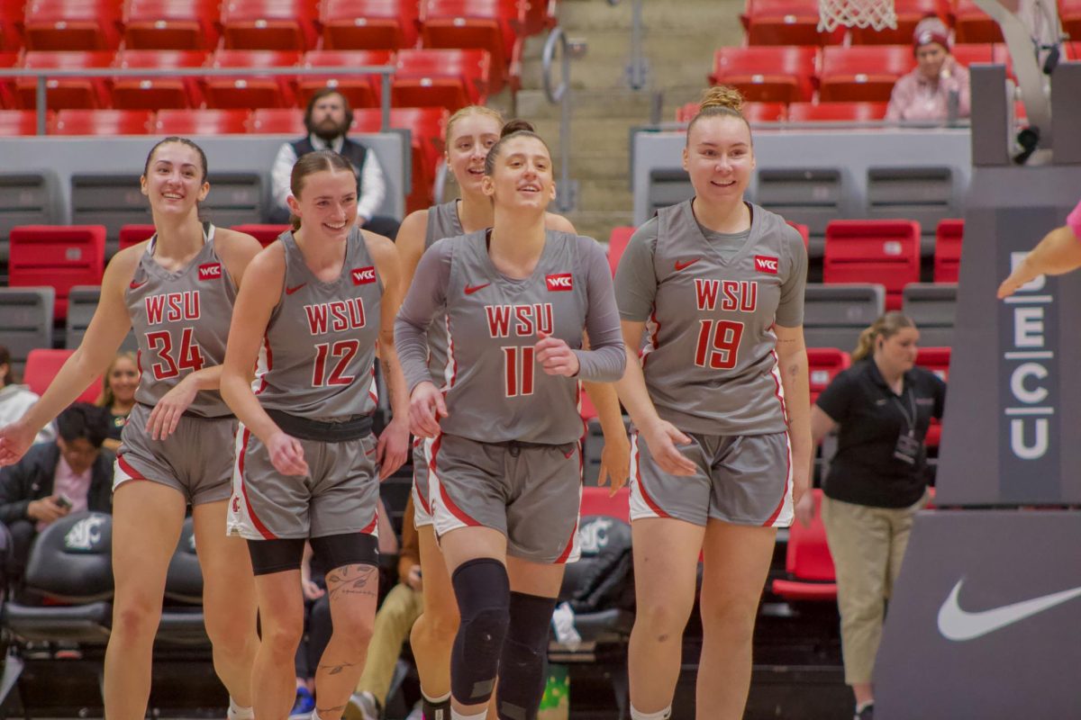 The Cougar women's basketball lineup breaks out of a team huddle against San Francisco on Feb. 23, in Pullman, WASH.