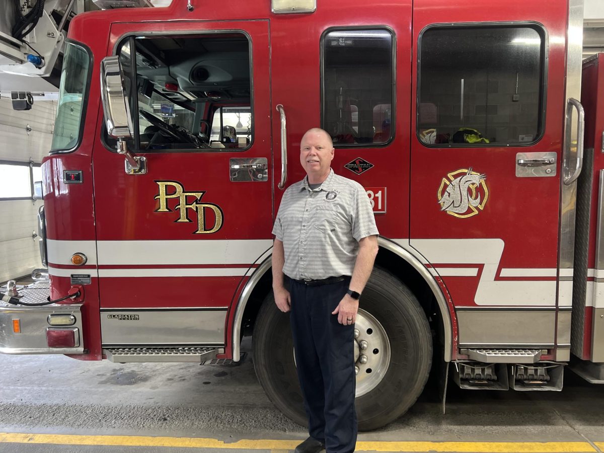 Fire Chief Mike Heston stands in front of a fire truck on Wednesday, Feb. 5 in Pullman.