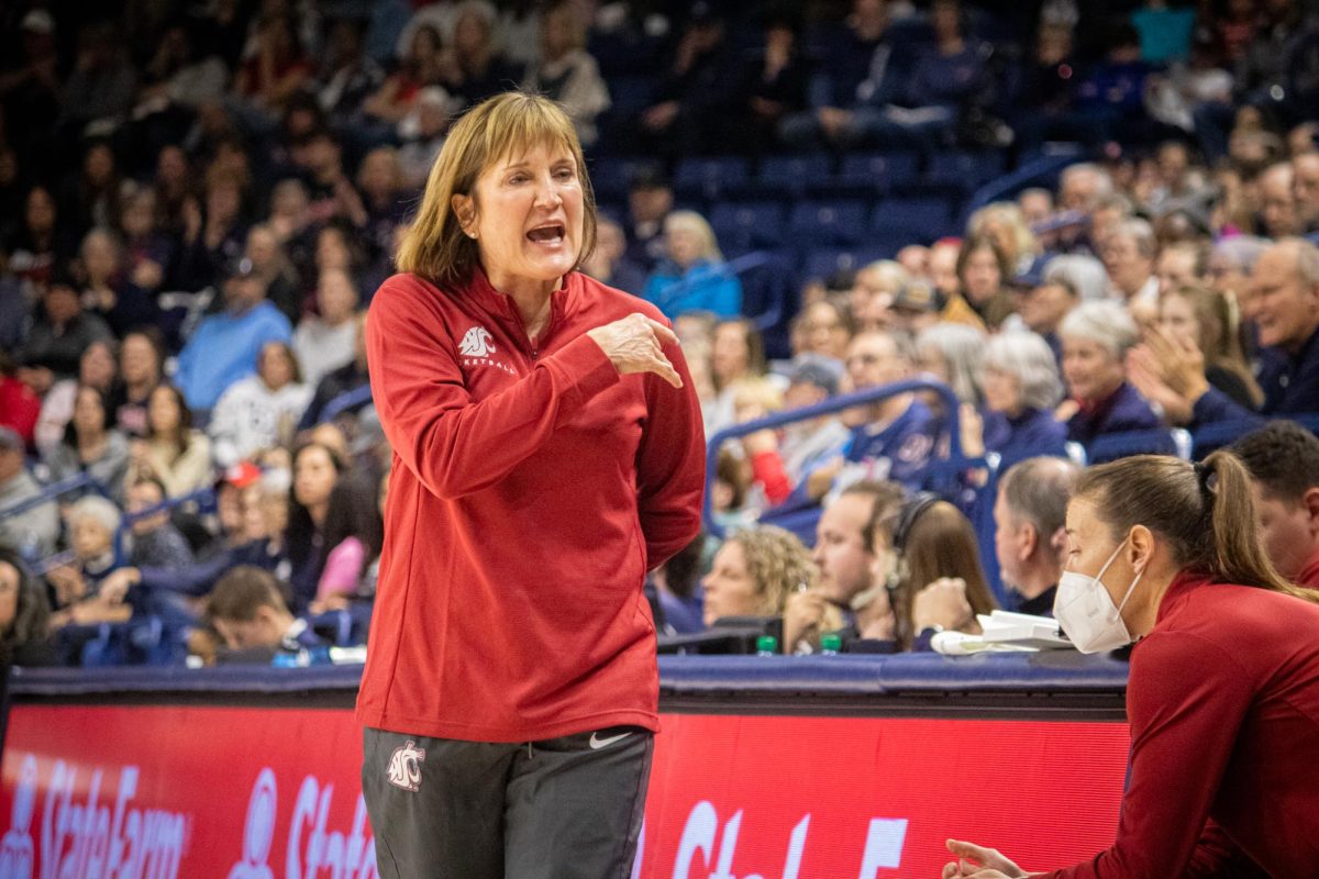 Washington State head coach Kamie Ethridge yells instructions to her bench after a tough play.