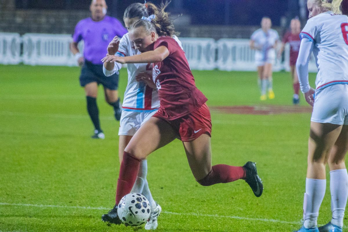 A WSU soccer player defends the ball against LMU on Oct. 11 2025. 