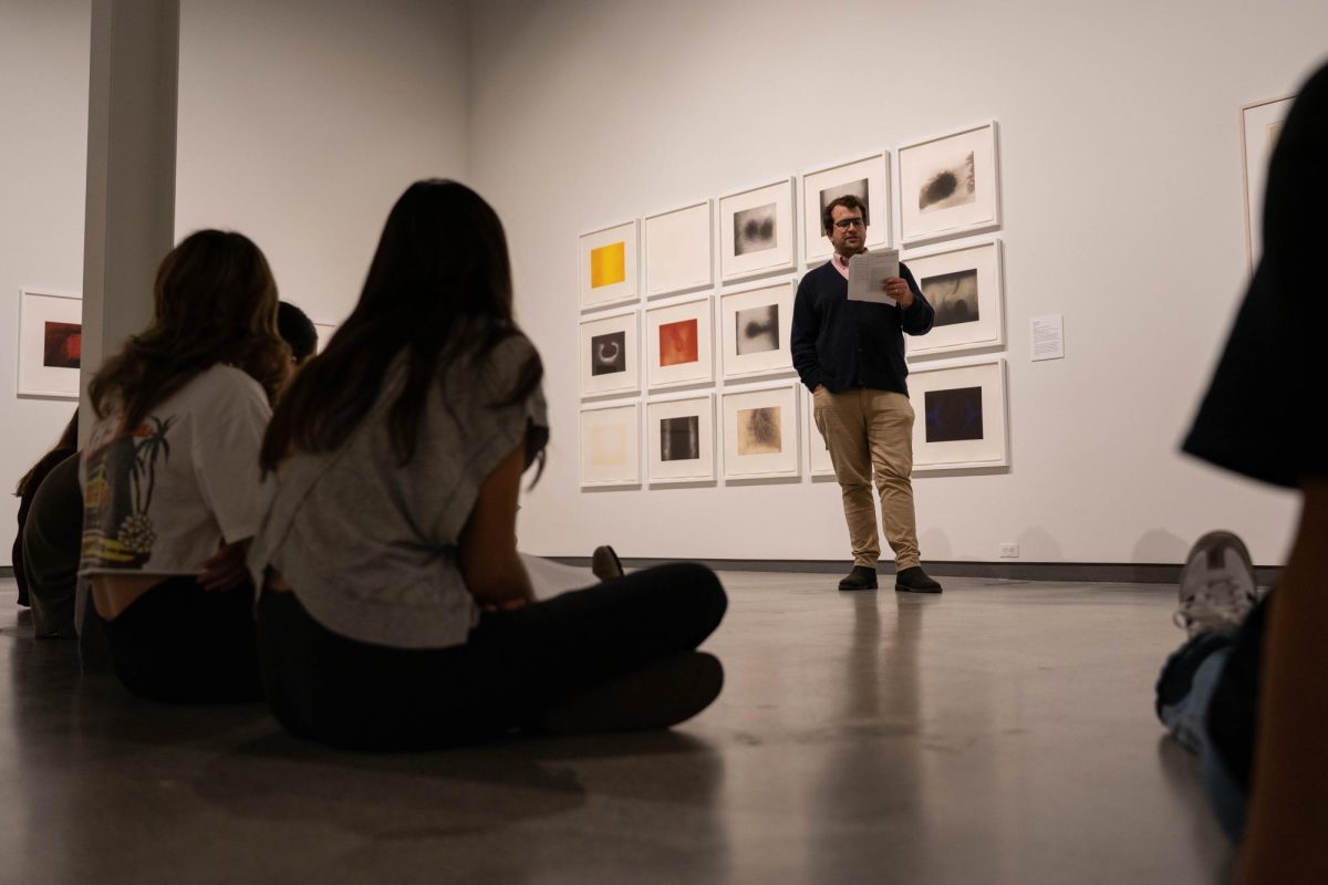 Washington State University Professor Colin Criss leads a Community Perspectives Exhibitions Tour at the Jordan Schnitzer Museum of Art on Thursday, Oct. 9. 