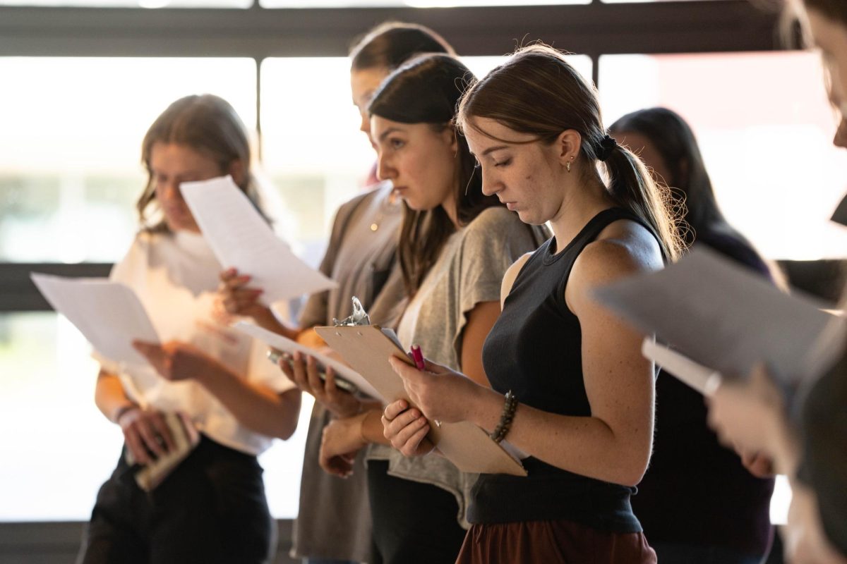 Students take notes during a Community Perspectives Exhibitions Tour at the Jordan Schnitzer Museum of Art on Thursday, Oct. 9. 