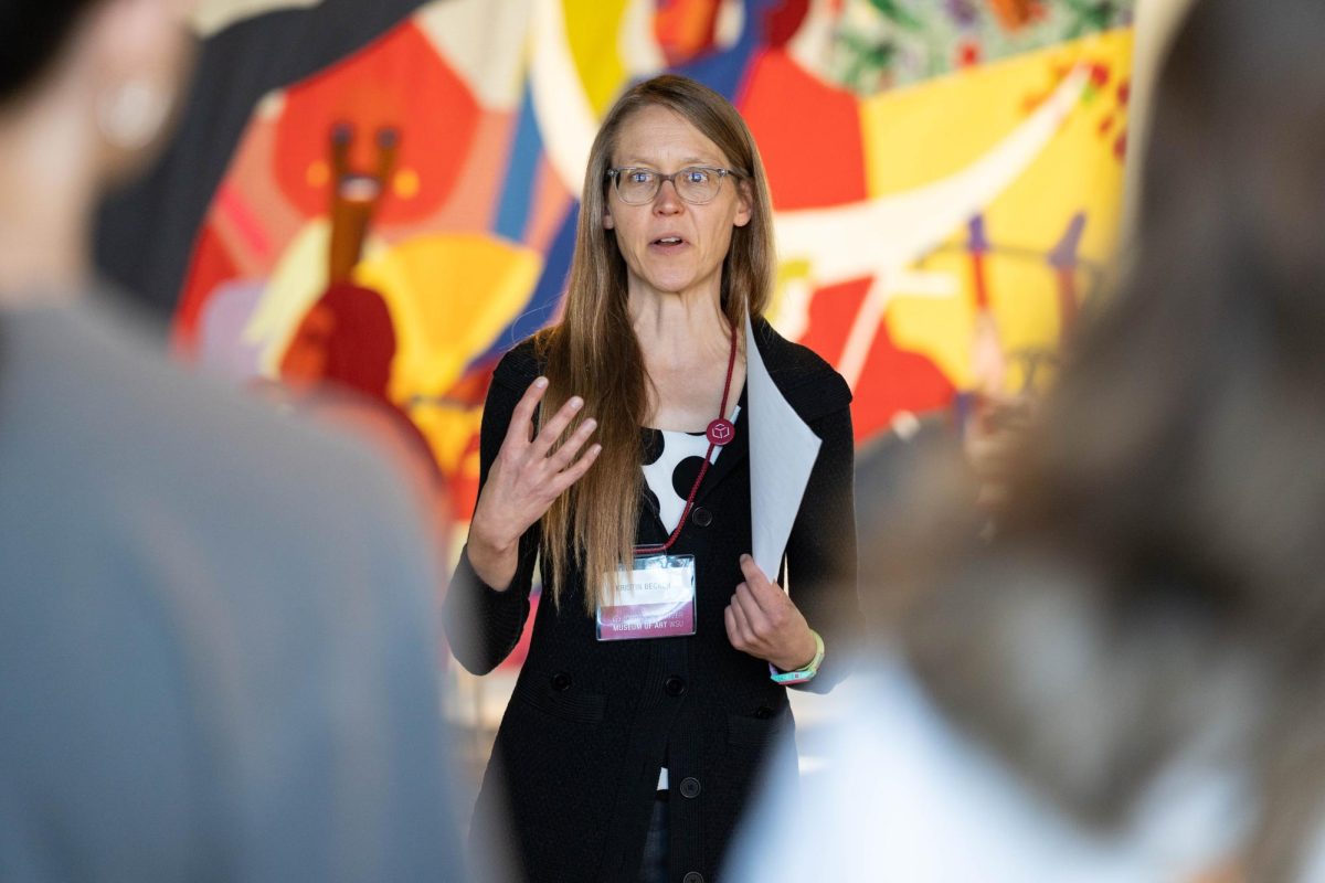 Washington State University Professor  Kristin Becker helps lead a Community Perspectives Exhibitions Tour at the Jordan Schnitzer Museum of Art on Thursday, Oct. 9.  