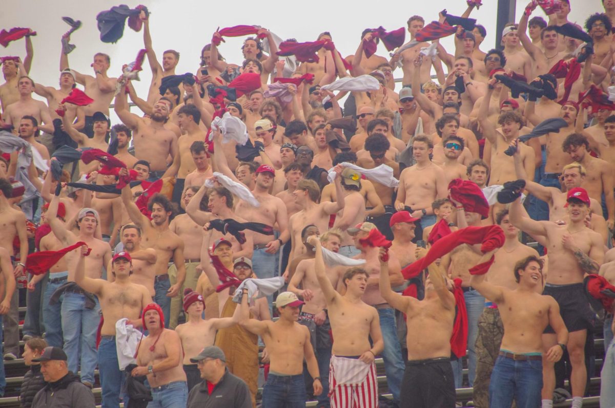 The crowd of shirtless fans twirling their clothes in the air atop the student section at the WSU vs. Toledo game, Oct. 25