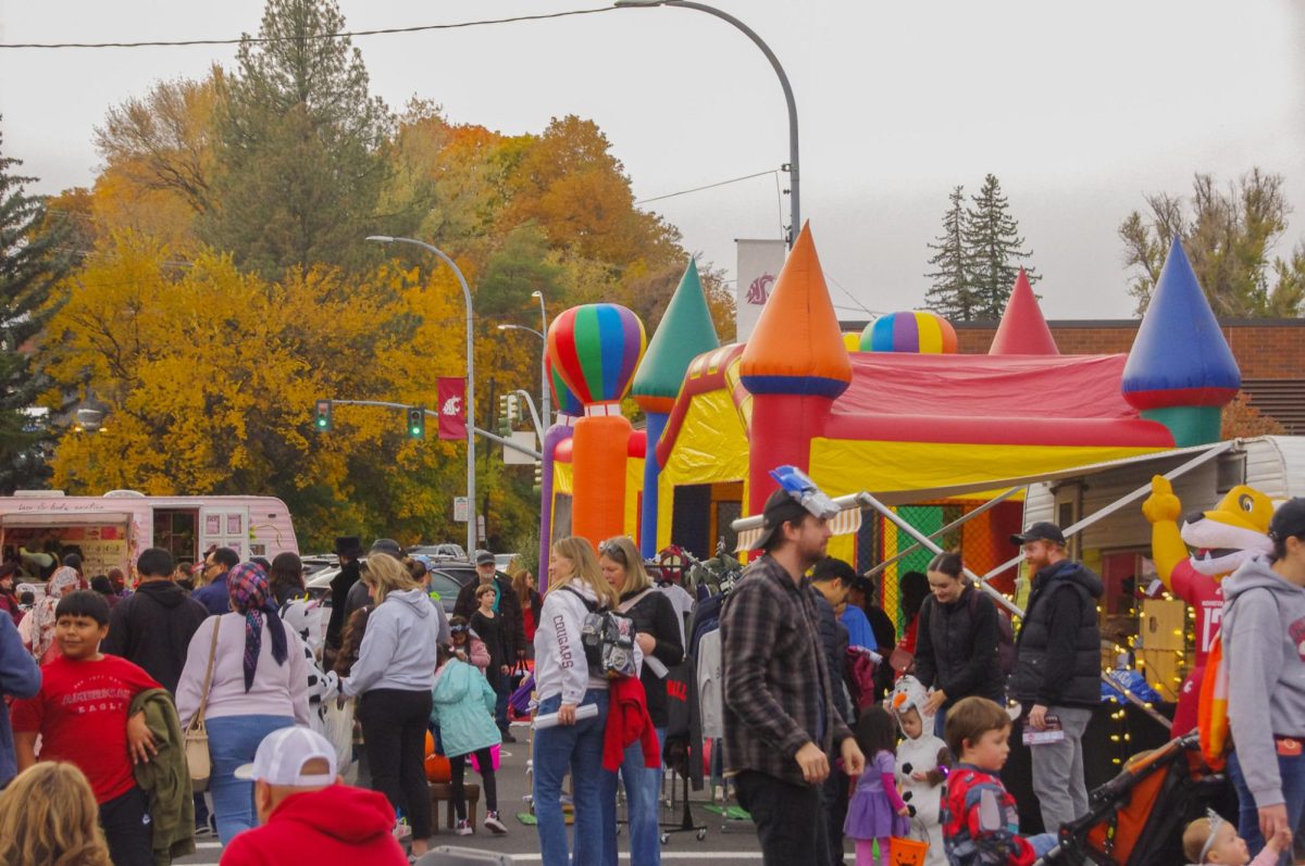 Downtown Pullman Association’s Trick-or-Treat event attendees visiting with local businesses and organizations, Oct. 24