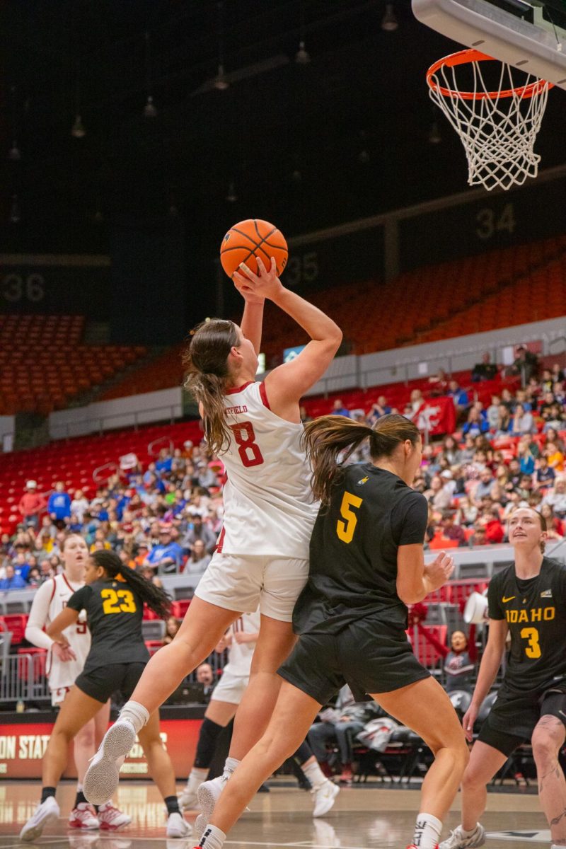 WSU Guard Mackenzie Chatfield goes in for a layup against University of Idaho Guard Ella Uriate, Nov. 3