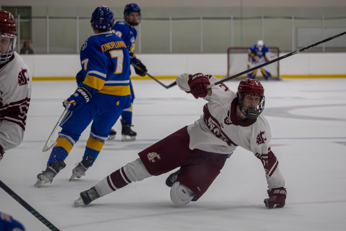 A WSU hockey player slides on the ice against San Jose State in the PAC-8 Showcase on Nov. 7, 2025. 