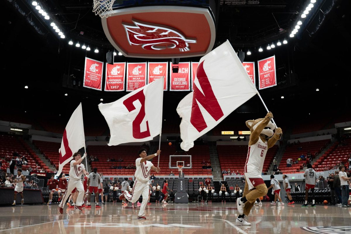 Flags are run onto the court ahead of the Cougars' win over Southern Utah on Wednesday, Nov. 19 at Beasley Colosseum. 