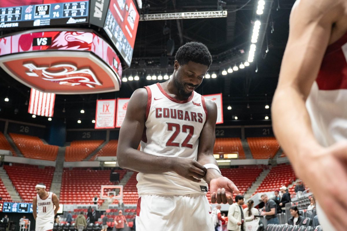 Washington State Forward ND Oakfor smiles while leaving the court after the Cougars' win over Southern Utah on Wednesday, Nov. 19 at Beasley Colosseum. 