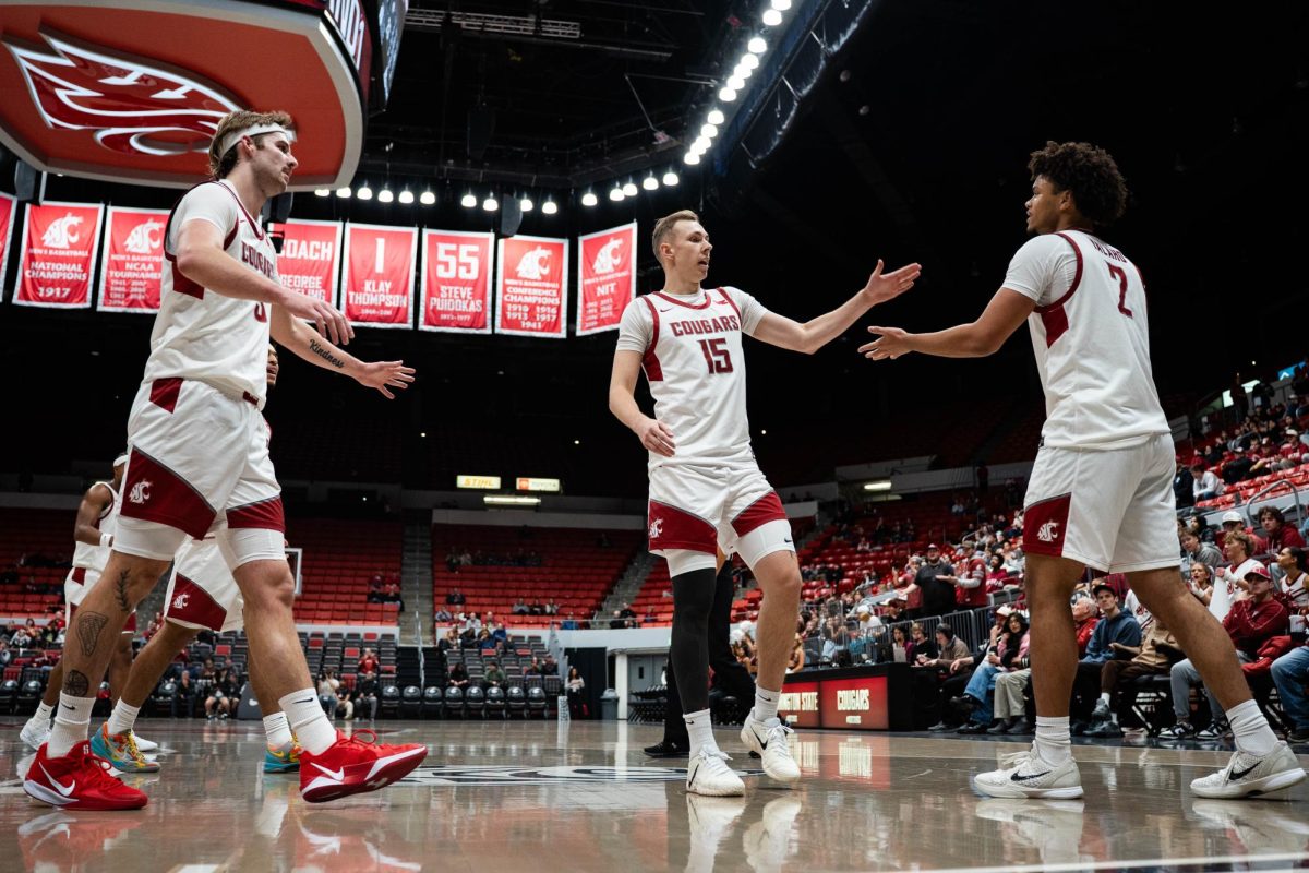 Washington State players high five during the Cougars' win over Southern Utah on Wednesday, Nov. 19 at Beasley Colosseum. 