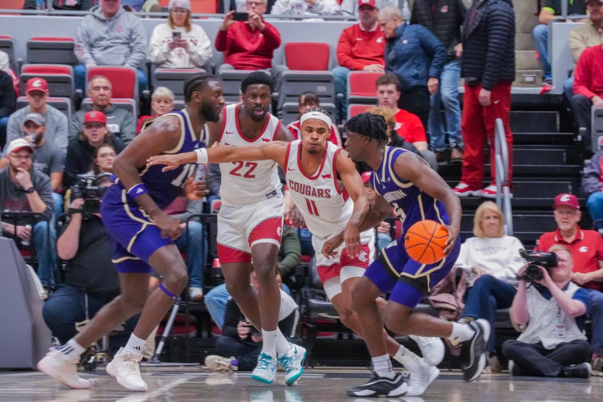 WSU Forward ND Okafor (L) and Guard Jerone Morton (R) playing defense between UW Center Franck Kepnang (L) and Guard Zoom Diallo, Nov. 14, 2025
