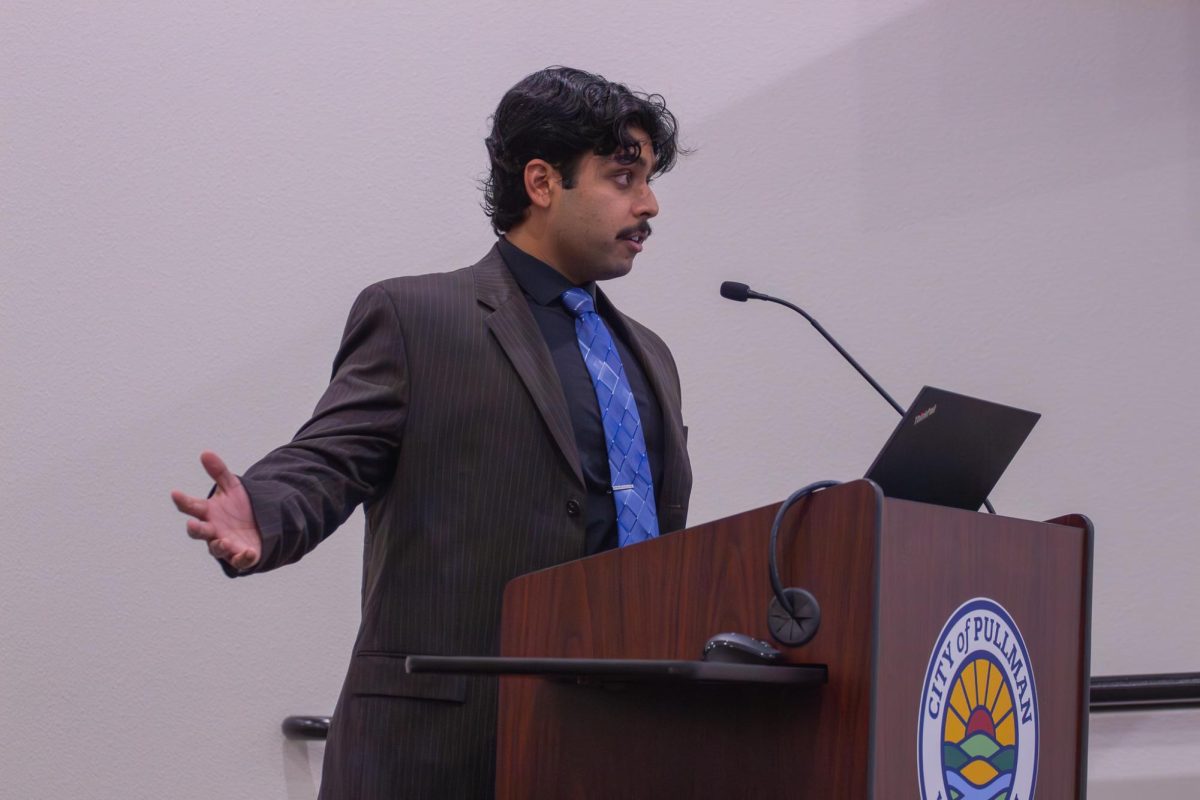 ASWSU Director of Legislative Affairs Bhargav Iyer speaks at the podium during the Pullman City Council meeting on Nov. 18, 2025.