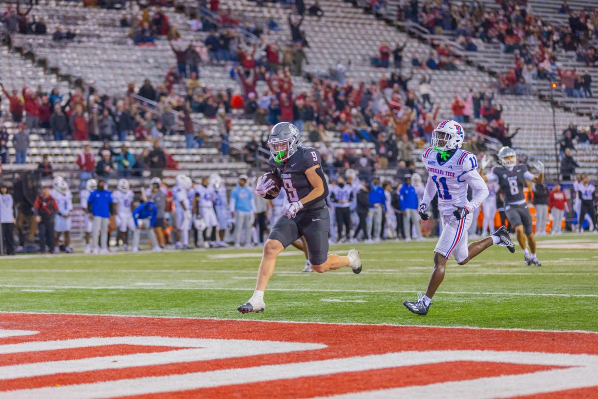 WSU Linebacker Caleb Francl charges into the end zone to score a touchdown against LA Tech, Nov. 15, 2025