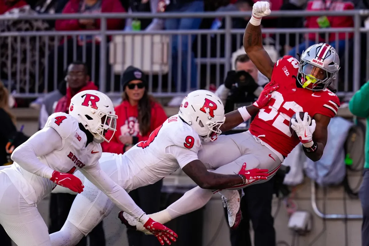 Ohio State Buckeyes running back Isaiah West (32) is pushed out of bounds by Rutgers Scarlet Knights defensive back Jett Elad (9) at Ohio Stadium on Saturday, Nov. 22, 2025 in Columbus, Ohio (Courtesy of Samantha Madar/Columbus Dispatch).