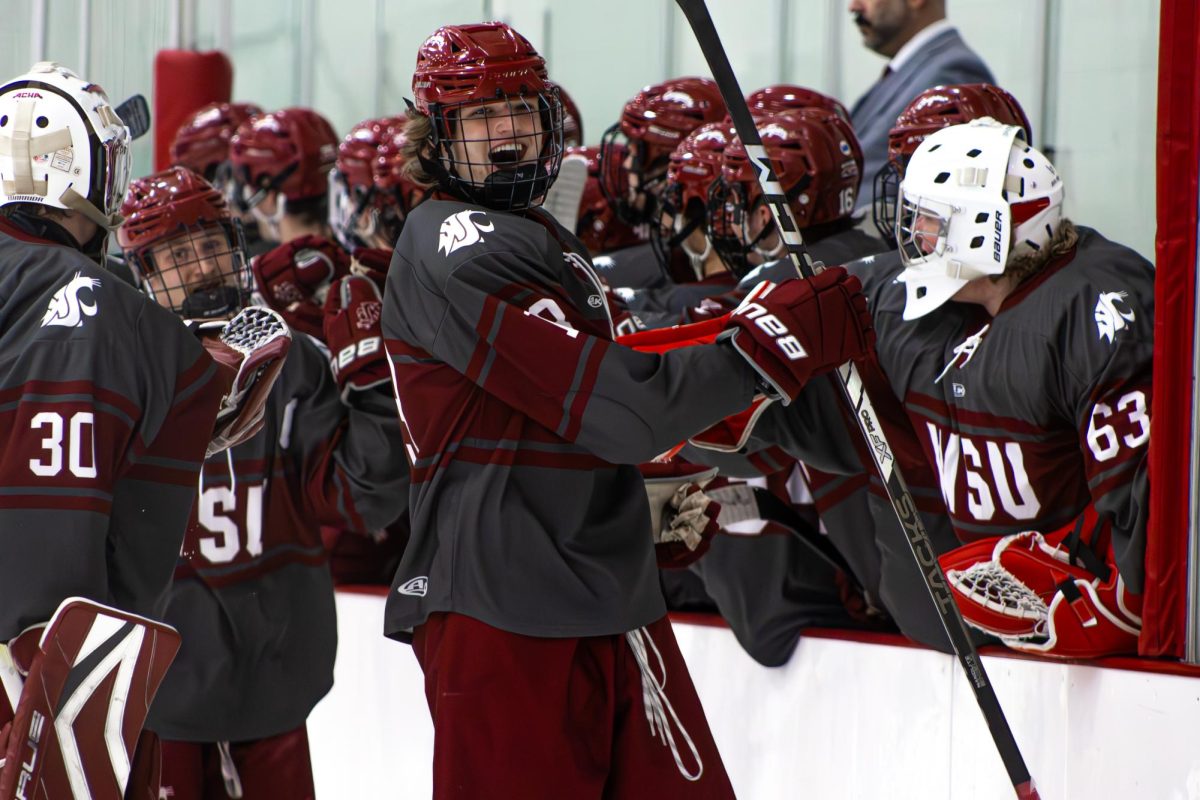 Freshman defenseman Lex Ballard celebrates a goal against the Eastern Washington hockey team on Dec. 6 2025. 