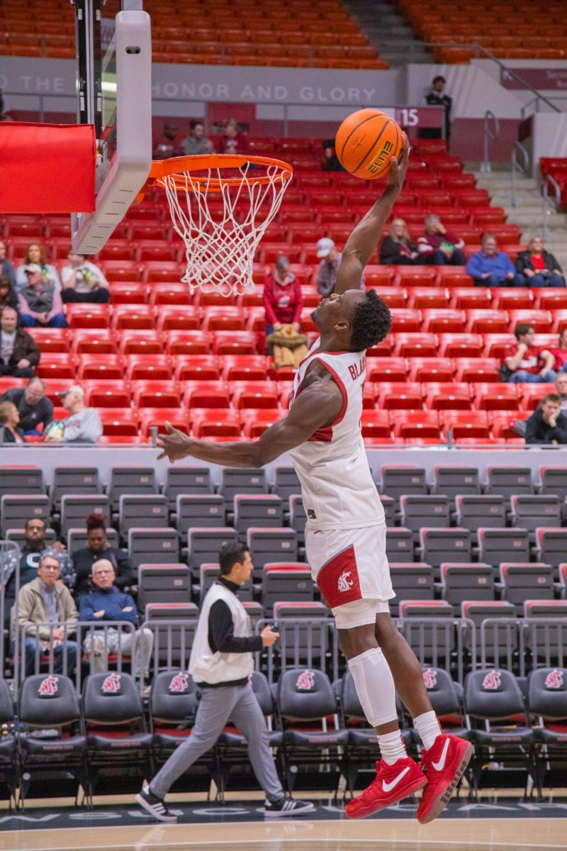 WSU Guard Dio Blakely dunks the ball during warm ups against University of Nevada, Dec. 7, 2025
