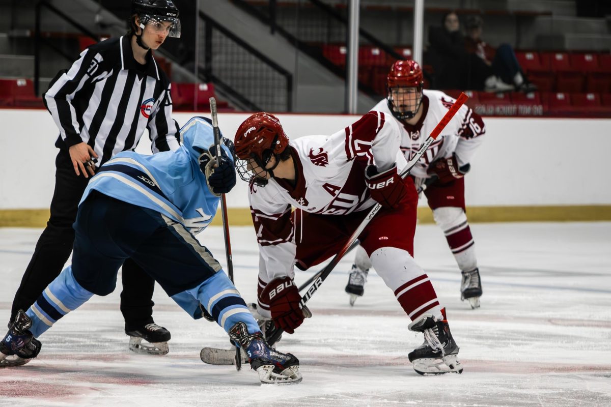 Van Rayner takes a face off against a Western Washington hockey player on Jan. 18 2026 in Cheney, Wa. 