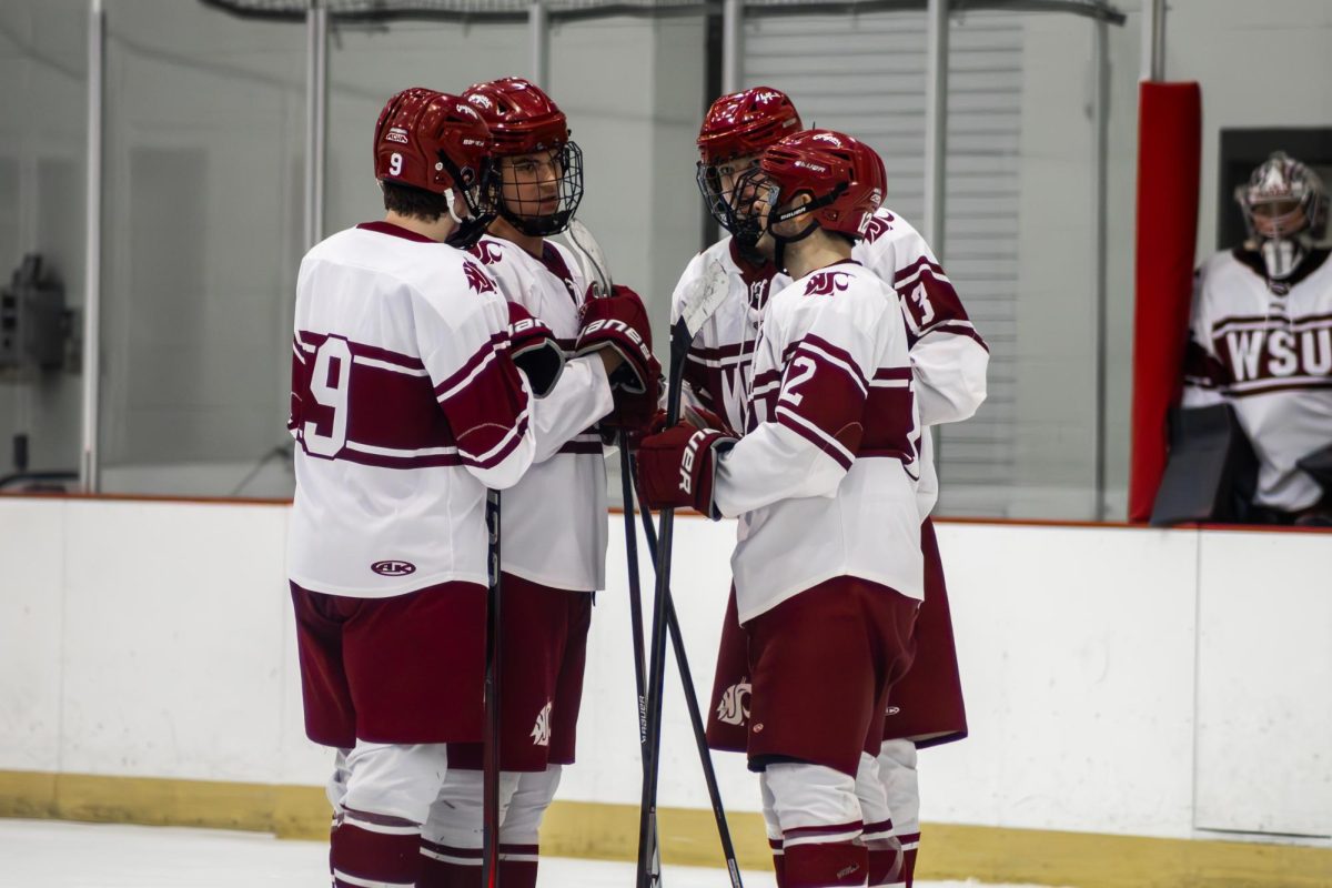 Lucas Robinson (9), Van Rayner (17), Lex Ballard (13) and Max Lazzaro (12) talking to each other between plays in a hockey game against Western Washington on Jan. 18 2026 in Cheney, Wa. 