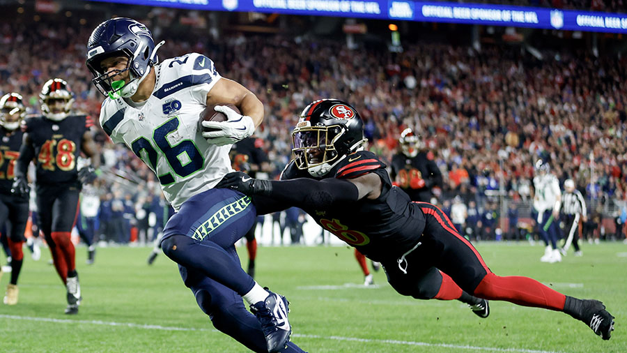 Zach Charbonnet shakes off a 49ers defender in Week 18 of the 2025-2026 National Football League season (Courtesy of Seattle Sports 710). 