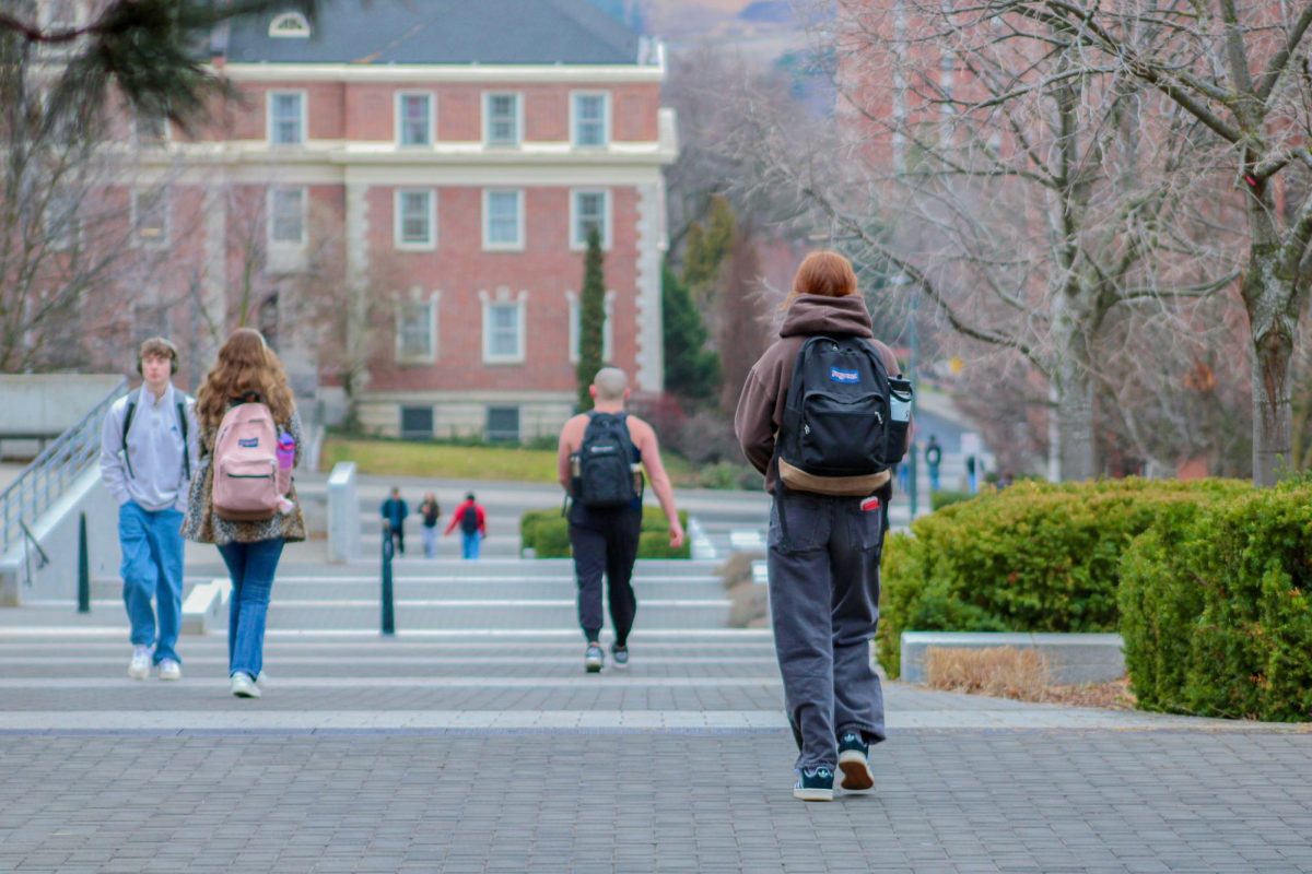 Students walking up Library Mall road on the WSU Pullman campus, Jan. 16, 2026.
